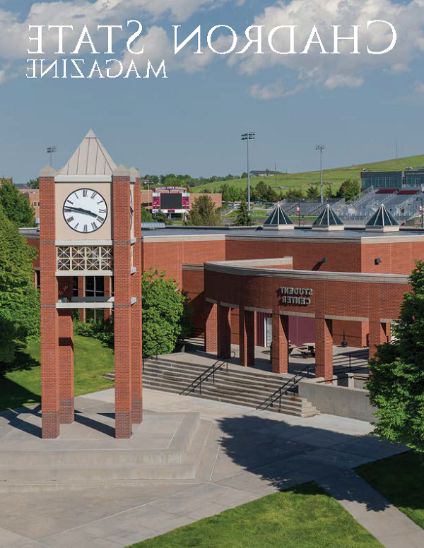 Cover of the winter 2023 issues of the Alumni magazine. It features and exterior photo of the student center and clock tower.