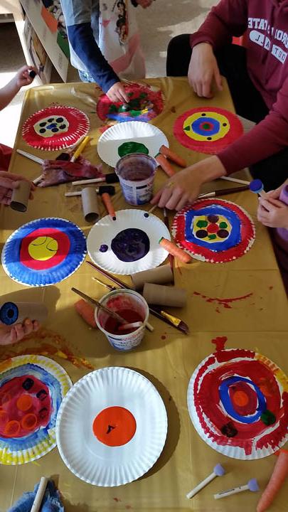 Painted paper plates on a table at the Child Development Center Laboratory